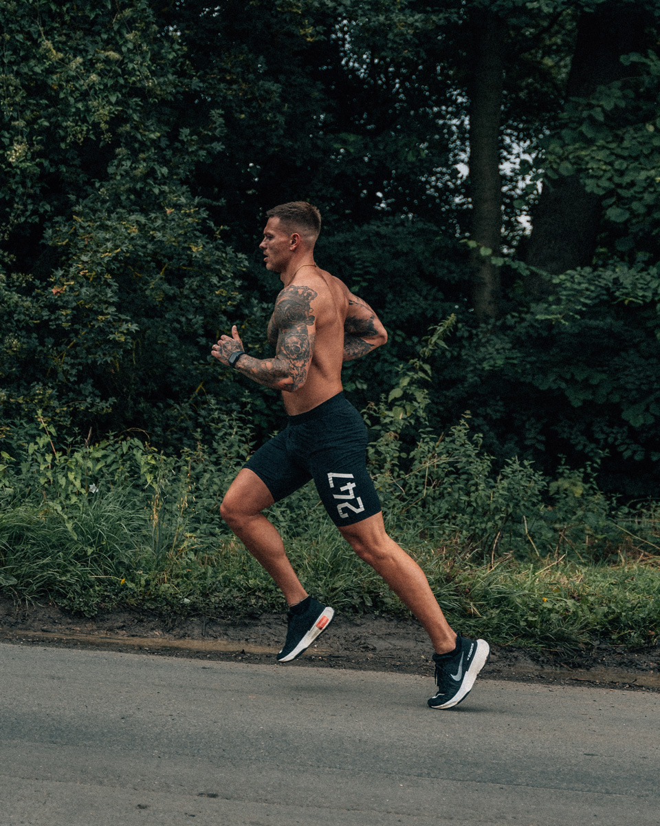 Coach is running outdoors.